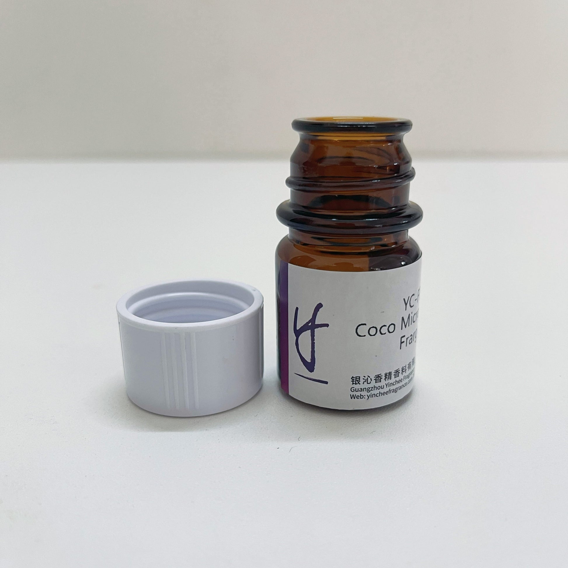 Open Yinchee Coco Mint Perfume Fragrance Oil sample vial with cap removed for scent evaluation and lab testing