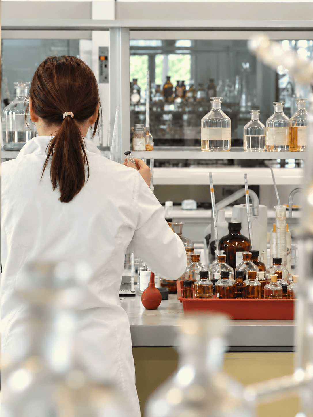 Production-line operator working with fragrance processing equipment